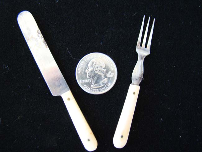 A charming 19th century child's bone handled fork and knife
